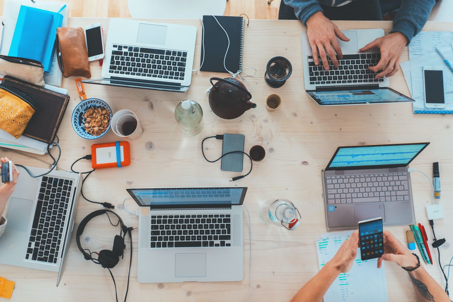 Business team working on laptops on a table