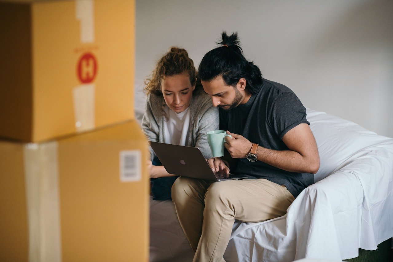 Homebuyers looking at a real estate agent facebook page